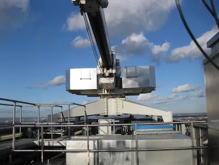 Window cleaning crane on tall building